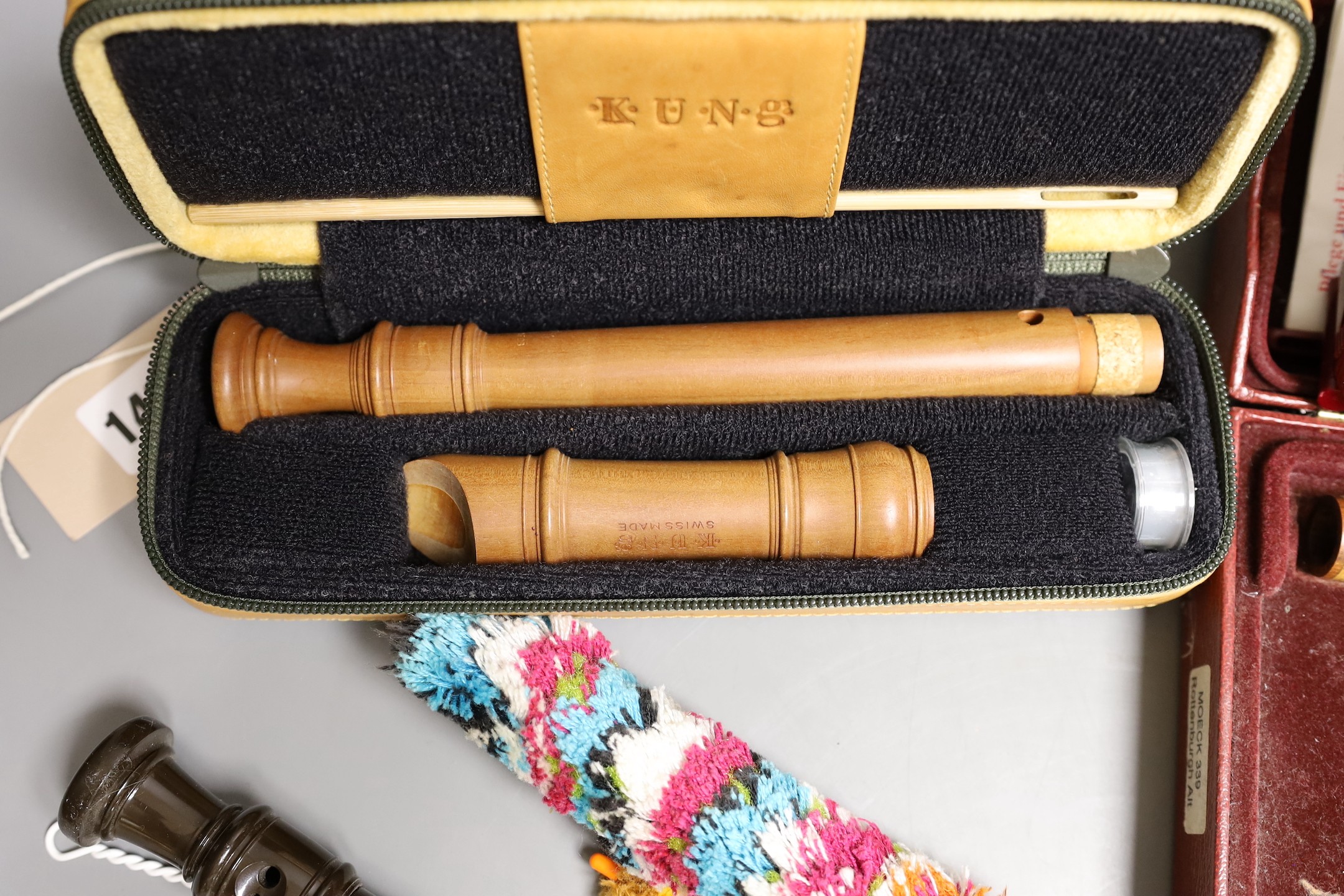 Two cased recorders, one other and a metronome etc